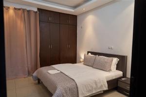Ένα ή περισσότερα κρεβάτια σε δωμάτιο στο Seddo Apartments