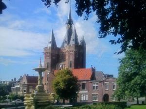 a building with a clock tower on top of it at Bed and Breakfast Opus 209 in Zwolle