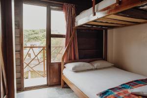 Postel nebo postele na pokoji v ubytování Esperanto Bed & Breakfast Surf Hostel