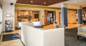 a lobby of a store with chairs and a counter at Holiday Inn Express & Suites Kingston-Ulster by IHG in Lake Katrine