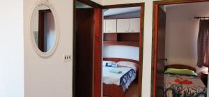 Postel nebo postele na pokoji v ubytování Apartmani Marija