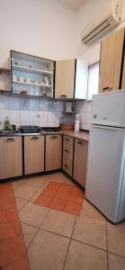 Kuchyň nebo kuchyňský kout v ubytování Apartmani Marija