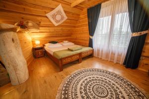 Postel nebo postele na pokoji v ubytování Domki u Bobaków