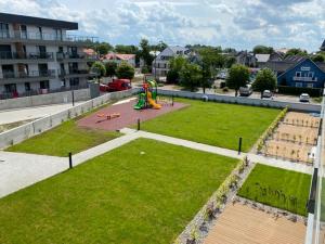 an aerial view of a park with a playground at Apartament SZAFIROWY Gardenia Dziwnów z widokiem na morze in Dziwnów