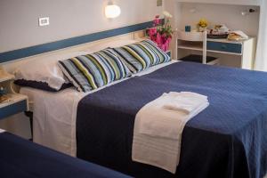Postel nebo postele na pokoji v ubytování HOTEL VENUS