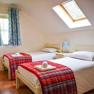 Postel nebo postele na pokoji v ubytování Holiday Cottages Portsalon