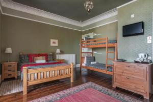 Postel nebo postele na pokoji v ubytování Aynetree Guest House