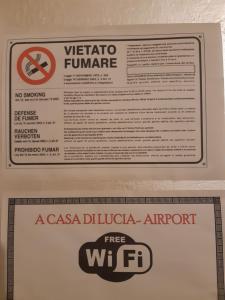 a sign in a box on top of a wf at Airport A Casa di Lucia in Pisa