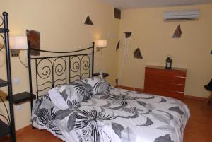 Casa Roque tesisinde bir odada yatak veya yataklar