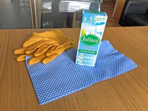 a blue rag and a carton of cleaner on a table at Saint Anns in London