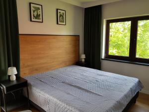 Postel nebo postele na pokoji v ubytování POD BRZEGIEM