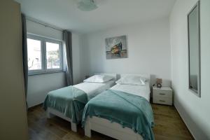 Postel nebo postele na pokoji v ubytování Holiday home MB