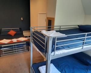 a bunk bed with two bunk beds in a room at Mount Stuart Hotel in Bournemouth