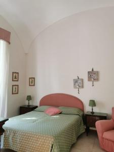 A bed or beds in a room at OASI DI PACE A GAETA