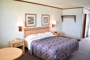 מיטה או מיטות בחדר ב-Blue Heron Motel