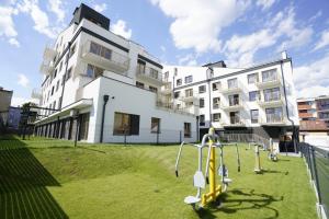 a building with a playground in front of a building at Apartament na Wspólnej ( centrum, garaż ) in Kielce