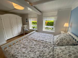 Cama o camas de una habitación en Ferienwohnung Alte Schmiede