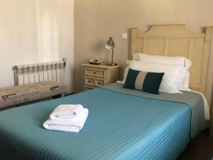 Postel nebo postele na pokoji v ubytování Residencial Celeste