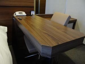 a wooden desk with a phone on top of it at Hotel Il Credo Gifu - Vacation STAY 84636 in Gifu