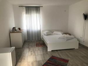 Postel nebo postele na pokoji v ubytování Casa Dada