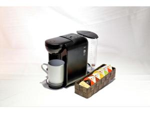 a coffee maker and a cup of coffee at Act Hotel Roppongi - Vacation STAY 84273 in Tokyo