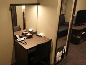 a desk in a hotel room with a mirror at Act Hotel Roppongi - Vacation STAY 85367 in Tokyo