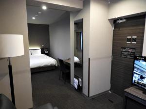 Säng eller sängar i ett rum på Act Hotel Roppongi - Vacation STAY 84276