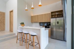 Kuchyň nebo kuchyňský kout v ubytování Himmapana Villas - Terraces - SHA Extra Plus