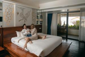 Voodi või voodid majutusasutuse HARI Residence & Spa toas