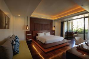 Voodi või voodid majutusasutuse HARI Residence & Spa toas