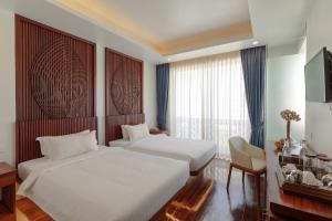 Voodi või voodid majutusasutuse HARI Residence & Spa toas
