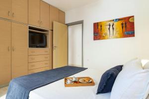 Posteľ alebo postele v izbe v ubytovaní Oasis in the Heart of Rhodes, next to Old Town, near Beaches - Haven Home