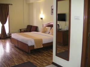 Hotel Preethi Classic Towers客房内的一张或多张床位