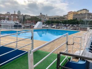 a large swimming pool on a cruise ship at Spinola Palace Apartment in Genoa