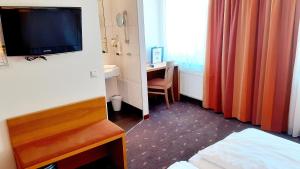 TV a/nebo společenská místnost v ubytování Hotel Fabrik Wien