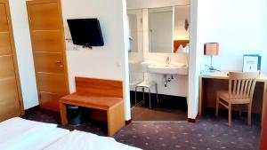 TV a/nebo společenská místnost v ubytování Hotel Fabrik Wien