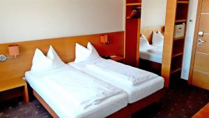 Postel nebo postele na pokoji v ubytování Hotel Fabrik Wien