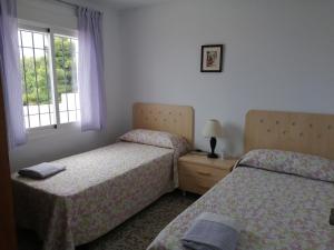 Cama o camas de una habitación en Apartamentos Panoramica