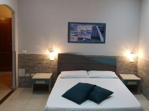 Postel nebo postele na pokoji v ubytování B&B AMURI RANNI