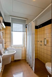 Koupelna v ubytování Hotel Kerpely