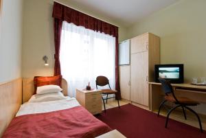 Postel nebo postele na pokoji v ubytování Hotel Kerpely
