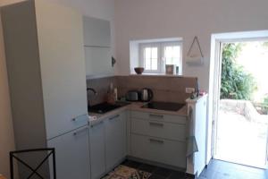 Kuchyňa alebo kuchynka v ubytovaní Apartment Amula