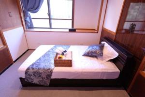Кровать или кровати в номере Kumi no Yado Gettou 2