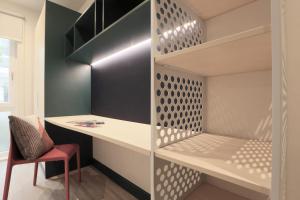 a walk in closet with a desk and a chair at ALTIDO Affordable Dublin Parkgate - Adults only in Dublin