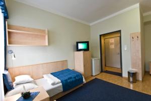 Postel nebo postele na pokoji v ubytování Hotel Kerpely