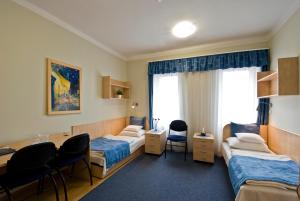 Postel nebo postele na pokoji v ubytování Hotel Kerpely