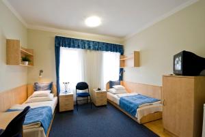 Postel nebo postele na pokoji v ubytování Hotel Kerpely