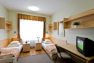 Postel nebo postele na pokoji v ubytování Hotel Kerpely