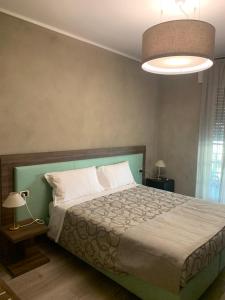Łóżko lub łóżka w pokoju w obiekcie Hotel Conca D'Oro ***S