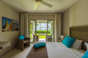 Кровать или кровати в номере Mon Choisy Beach R.